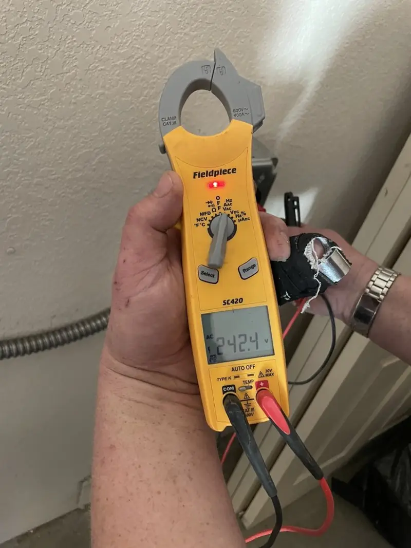 Voltage testing with clamp meter during Electrical Installation Services in Iowa City